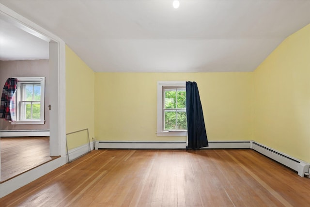 133 Front St, Old Town, ME 04468 - bonus room featuring wood finished floors, a baseboard heating unit, and lofted ceiling