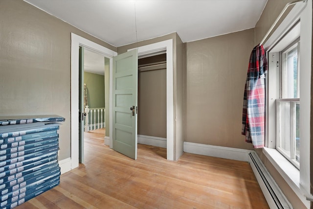 133 Front St, Old Town, ME 04468 - spacious closet featuring a baseboard heating unit and light wood-style floors