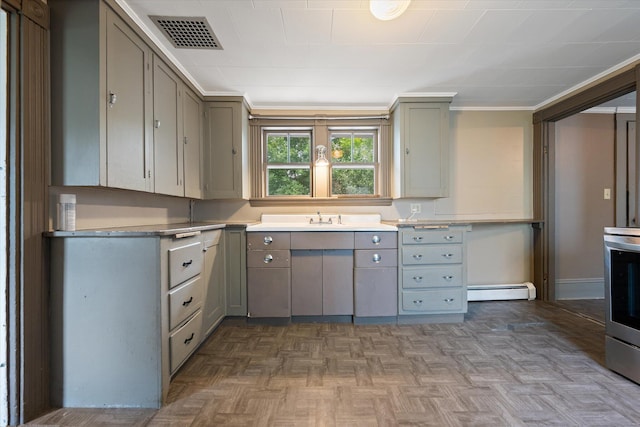 133 Front St, Old Town, ME 04468 - kitchen with gray cabinetry, a baseboard radiator, and stainless steel electric range