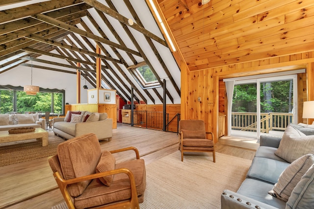 12 Michaud Ln, Bridgton, ME 04009 - living area featuring wooden walls, wood finished floors, and a skylight