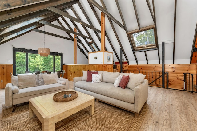 12 Michaud Ln, Bridgton, ME 04009 - living area with wainscoting, light wood-style flooring, and wood walls