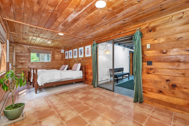 12 Michaud Ln, Bridgton, ME 04009 - bedroom with wooden walls, wooden ceiling, tile patterned flooring, and access to outside