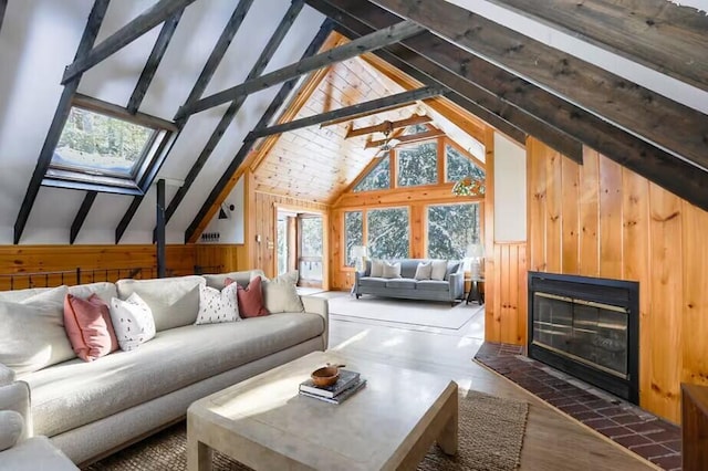 12 Michaud Ln, Bridgton, ME 04009 - living area featuring a glass covered fireplace, wooden walls, and wood finished floors