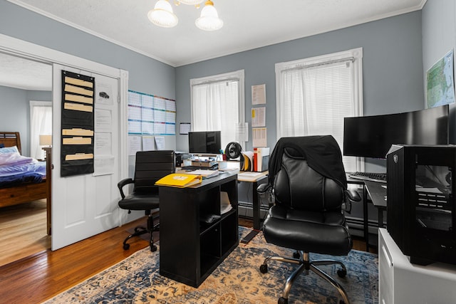 22 Union St, Biddeford, ME 04005 - office space with wood finished floors, crown molding, a chandelier, and a baseboard heating unit