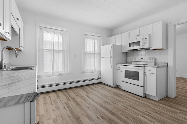 22 Union St, Biddeford, ME 04005 - kitchen with white appliances, a sink, baseboard heating, white cabinetry, and light wood-style floors