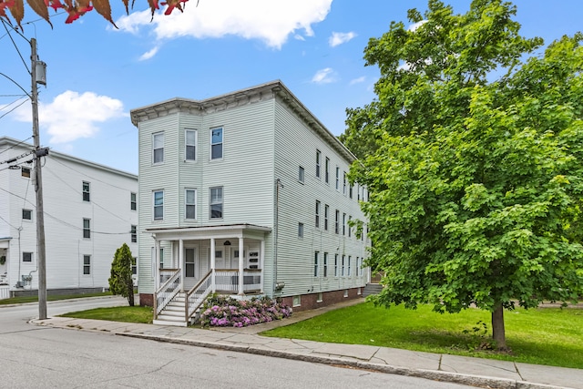 22 Union St, Biddeford, ME 04005 - view of front of property with a porch and a front lawn