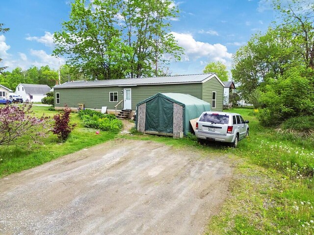 55 Cindy Blodgett Dr, Clinton, ME 04927 - view of front facade with entry steps and driveway