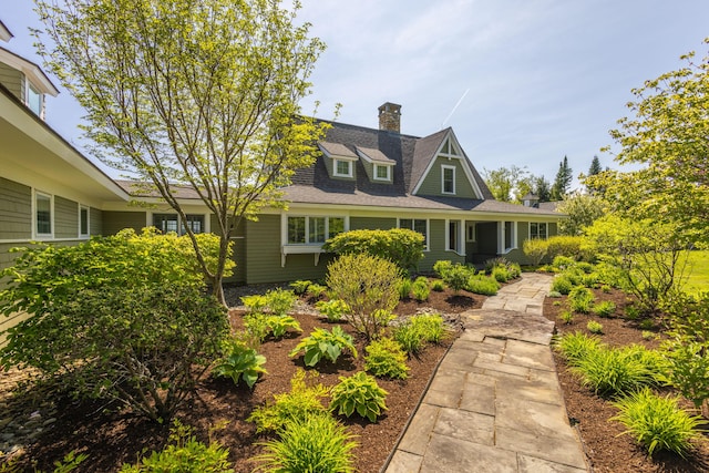 321 Beech Hill Rd, Northport, ME 04849 - view of front facade featuring a chimney and a shingled roof