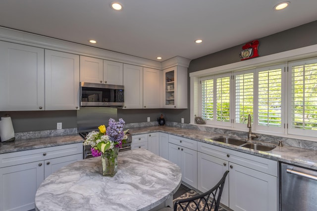321 Beech Hill Rd, Northport, ME 04849 - kitchen featuring appliances with stainless steel finishes, a sink, recessed lighting, healthy amount of natural light, and glass insert cabinets