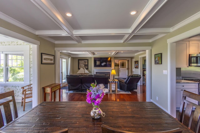 321 Beech Hill Rd, Northport, ME 04849 - dining room featuring healthy amount of natural light, coffered ceiling, baseboards, wood finished floors, and a fireplace