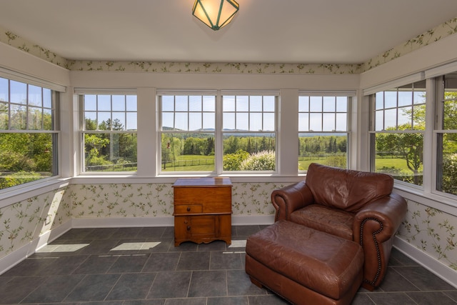 321 Beech Hill Rd, Northport, ME 04849 - sunroom with baseboards, wallpapered walls, and tile patterned flooring