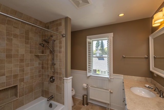 321 Beech Hill Rd, Northport, ME 04849 - full bath featuring radiator, toilet, wainscoting, vanity, and shower / bath combination