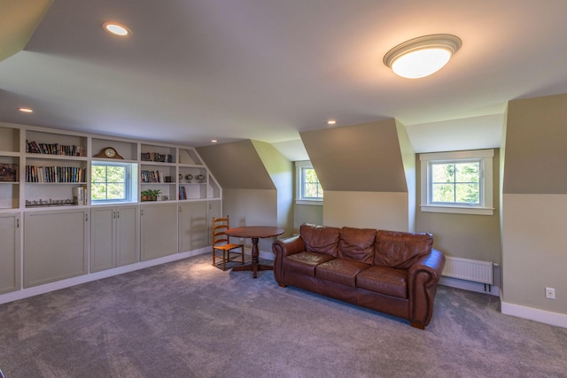 321 Beech Hill Rd, Northport, ME 04849 - carpeted living room featuring radiator, healthy amount of natural light, vaulted ceiling, recessed lighting, and baseboards