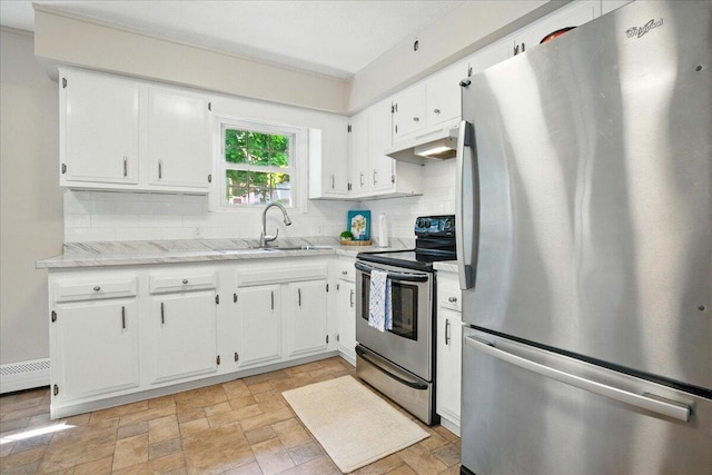 46 Jeffrey St, Lewiston, ME 04240 - kitchen with appliances with stainless steel finishes, under cabinet range hood, decorative backsplash, a sink, and white cabinetry