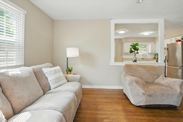 46 Jeffrey St, Lewiston, ME 04240 - living room with dark wood-type flooring and baseboards