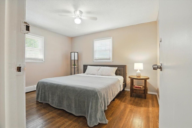 46 Jeffrey St, Lewiston, ME 04240 - bedroom featuring dark wood-style floors, baseboards, and a ceiling fan
