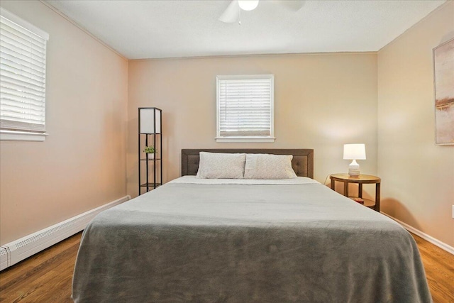 46 Jeffrey St, Lewiston, ME 04240 - bedroom featuring wood finished floors, multiple windows, baseboards, and ceiling fan