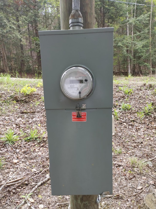 10 Lakeview Dr, Garland, ME 04939 - exterior view of a heavily wooded area and electric meter
