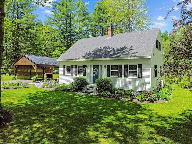 11 Lewis Rd, Sidney, ME 04330 - new england style home featuring a chimney, roof with shingles, and a front yard