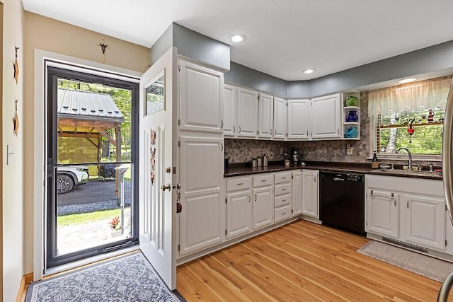 11 Lewis Rd, Sidney, ME 04330 - kitchen with dishwasher, light wood-type flooring, dark countertops, white cabinets, and recessed lighting