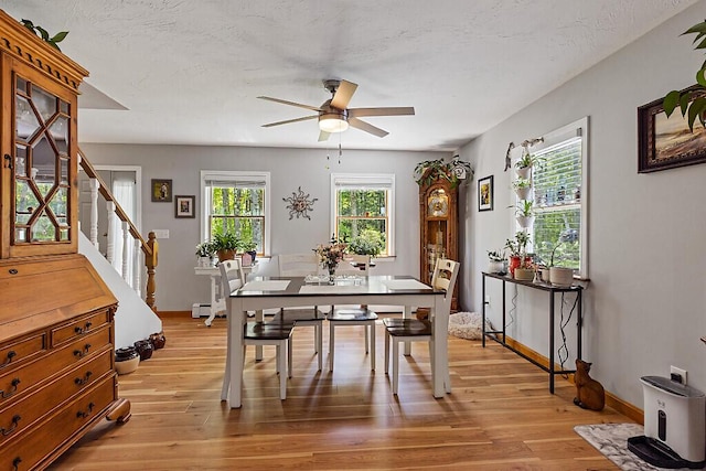 11 Lewis Rd, Sidney, ME 04330 - dining space featuring stairs, a ceiling fan, light wood-style floors, baseboards, and a textured ceiling