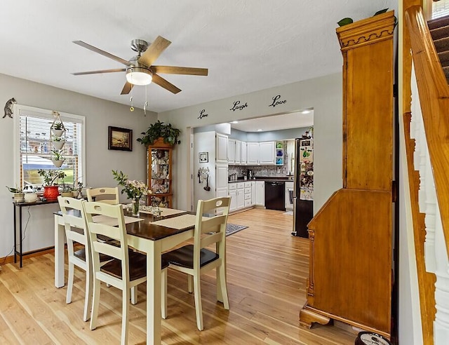 11 Lewis Rd, Sidney, ME 04330 - dining space with ceiling fan, light wood-style flooring, and stairway