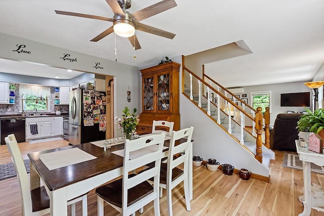 11 Lewis Rd, Sidney, ME 04330 - dining area featuring plenty of natural light, light wood-style floors, a ceiling fan, and stairway