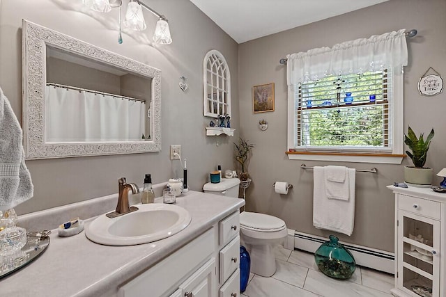 11 Lewis Rd, Sidney, ME 04330 - bathroom with vanity, a baseboard radiator, toilet, and tile patterned flooring