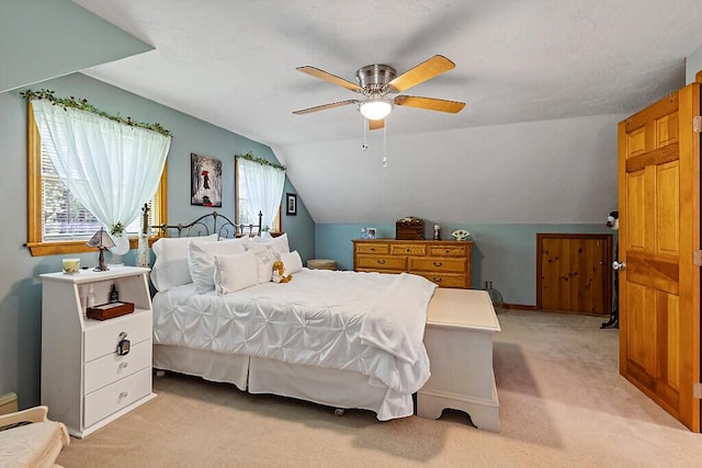11 Lewis Rd, Sidney, ME 04330 - bedroom with light colored carpet, vaulted ceiling, ceiling fan, and baseboards