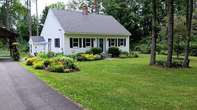 11 Lewis Rd, Sidney, ME 04330 - view of front of house with a chimney, roof with shingles, and a front yard