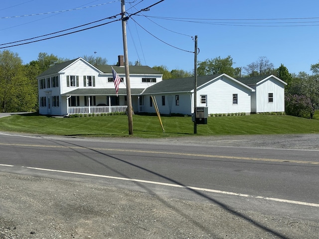 13 Main St, Cambridge, ME 04923 - view of front of property with a front yard and covered porch