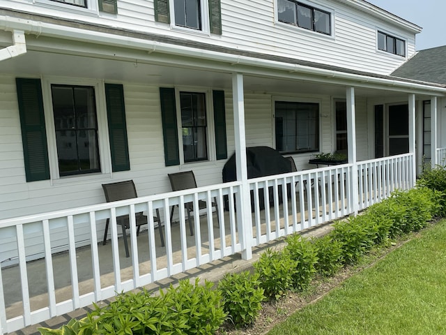 13 Main St, Cambridge, ME 04923 - view of property exterior featuring a porch and a shingled roof