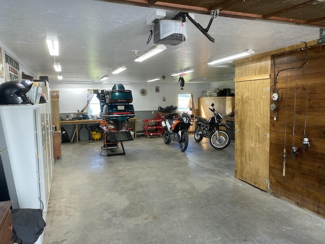 13 Main St, Cambridge, ME 04923 - garage featuring a garage door opener and a workshop area