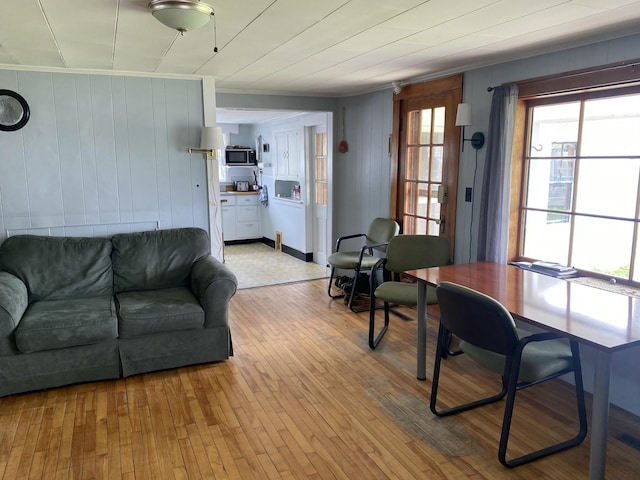 13 Main St, Cambridge, ME 04923 - living room with crown molding, light wood finished floors, and wood walls