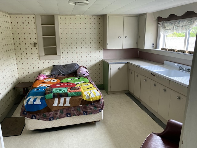 13 Main St, Cambridge, ME 04923 - bedroom with wallpapered walls, a sink, and light flooring