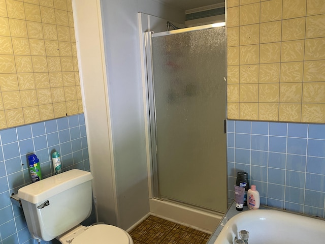 13 Main St, Cambridge, ME 04923 - bathroom with tile walls, a shower stall, toilet, tile patterned flooring, and a tub to relax in