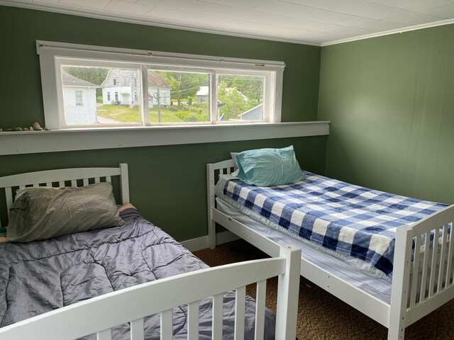 13 Main St, Cambridge, ME 04923 - carpeted bedroom featuring ornamental molding and multiple windows