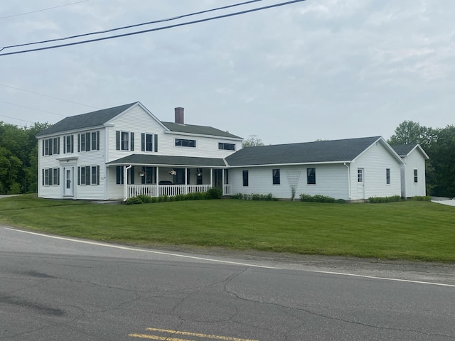 13 Main St, Cambridge, ME 04923 - colonial house featuring a chimney, a porch, and a front yard