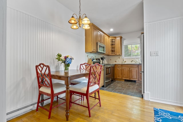 60 Barrell Ln Unit 1, York, ME 03909 - dining room with a chandelier and dark wood-type flooring