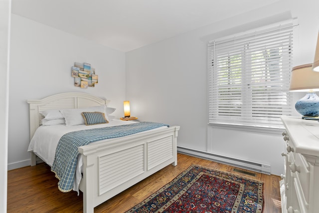 60 Barrell Ln Unit 1, York, ME 03909 - bedroom with a baseboard heating unit and wood finished floors