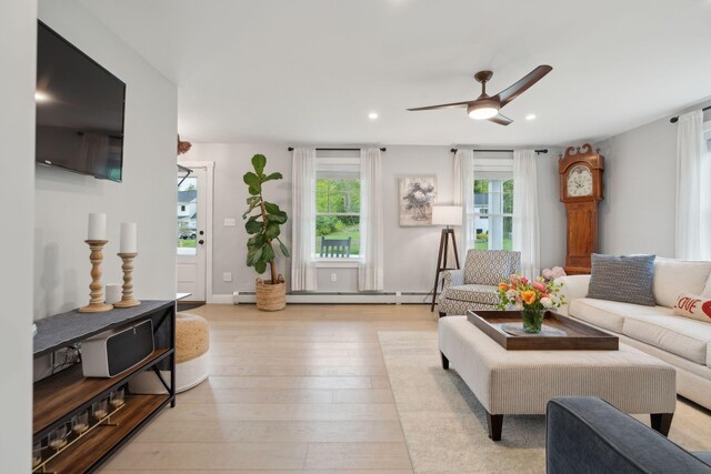 40 Sabatus Ln, Windham, ME 04062 - living room with healthy amount of natural light, a ceiling fan, recessed lighting, light wood-type flooring, and a baseboard heating unit