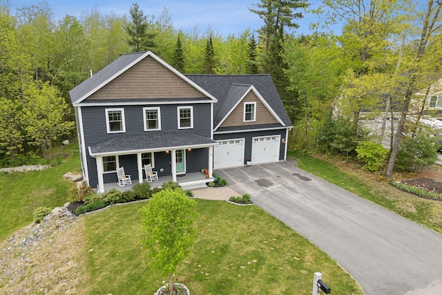 40 Sabatus Ln, Windham, ME 04062 - view of front of property with covered porch, asphalt driveway, and a front lawn
