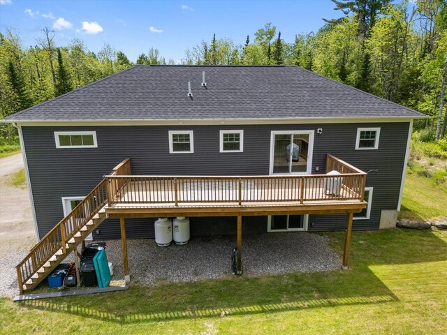 45 Doughty Blvd, Levant, ME 04456 - rear view of house with a wooden deck, a shingled roof, and stairs
