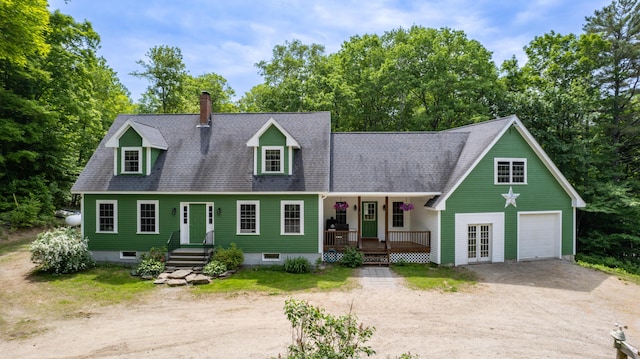 310 Fields Hill Rd, Sumner, ME 04292 - cape cod-style house featuring driveway, covered porch, a chimney, a garage, and roof with shingles
