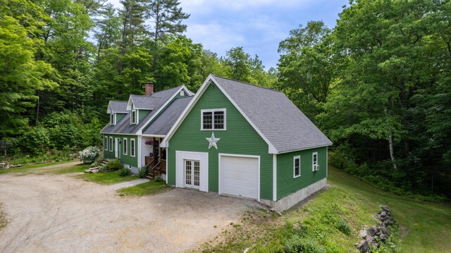 310 Fields Hill Rd, Sumner, ME 04292 - view of front of house with dirt driveway, a shingled roof, a chimney, and a garage