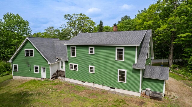 310 Fields Hill Rd, Sumner, ME 04292 - rear view of house featuring roof with shingles, a chimney, and a lawn