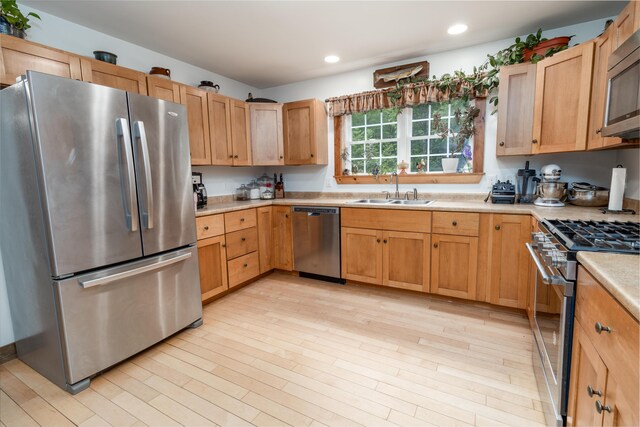 310 Fields Hill Rd, Sumner, ME 04292 - kitchen featuring appliances with stainless steel finishes, a sink, light countertops, light wood-type flooring, and recessed lighting