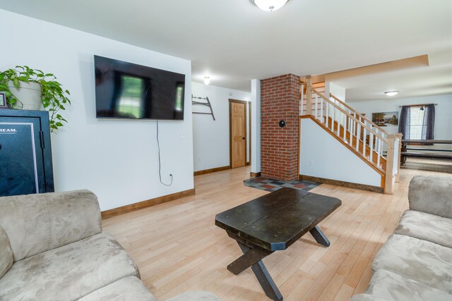310 Fields Hill Rd, Sumner, ME 04292 - living room featuring stairway, hardwood / wood-style flooring, and baseboards
