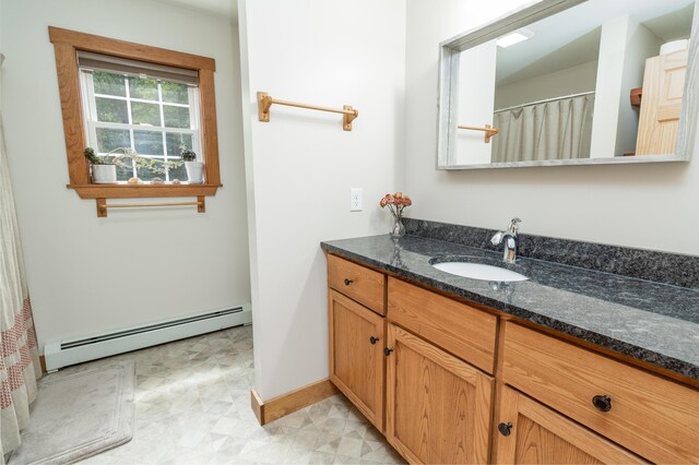310 Fields Hill Rd, Sumner, ME 04292 - full bathroom featuring baseboard heating, vanity, baseboards, and tile patterned floors