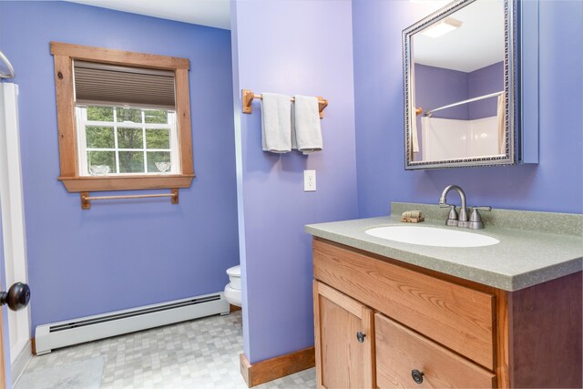 310 Fields Hill Rd, Sumner, ME 04292 - bathroom featuring a baseboard radiator, vanity, toilet, a shower, and baseboards